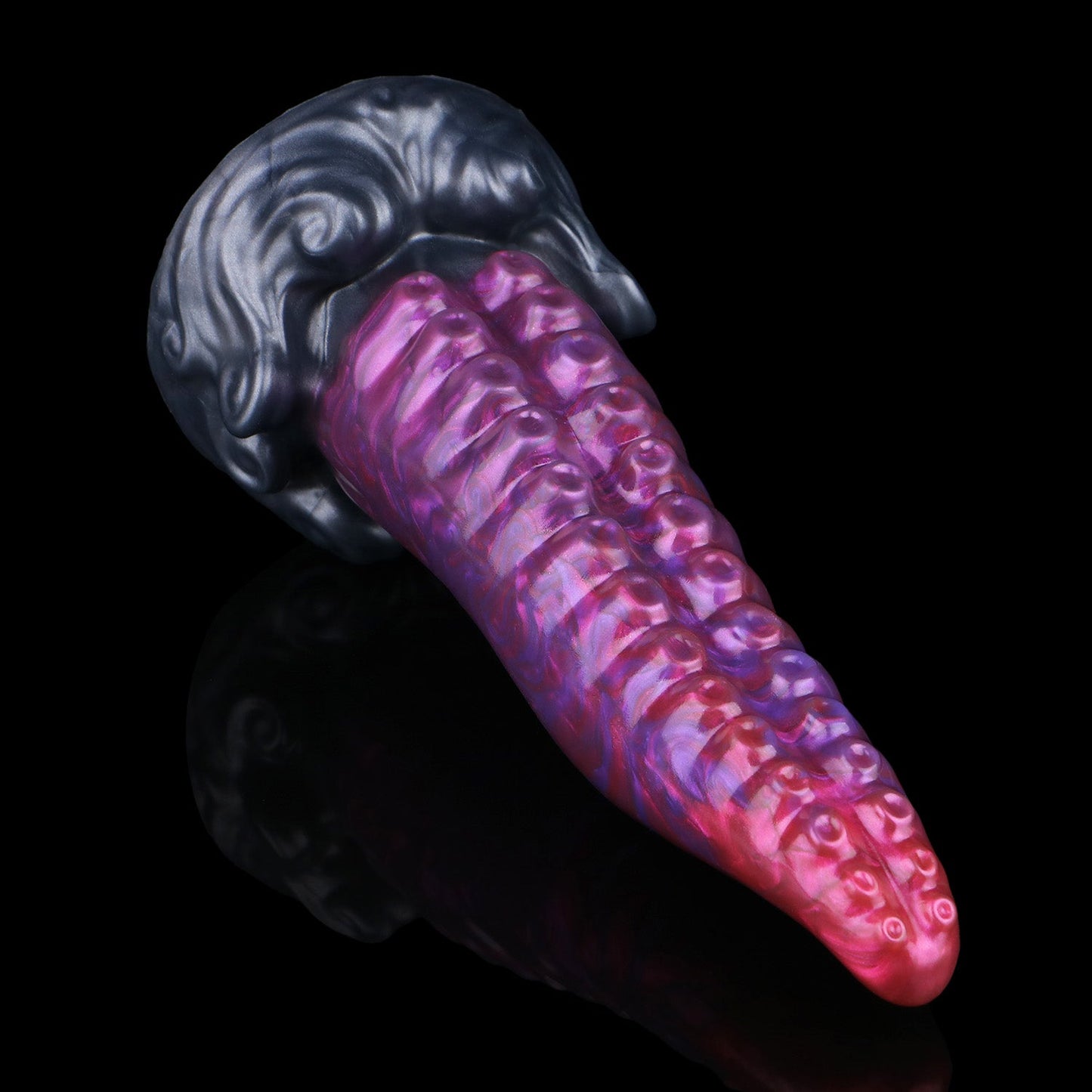 Tendrul the Tentacle dildo, Adrenaline colorway, lying at an angle showing the suckers and sculpted whirlpool base