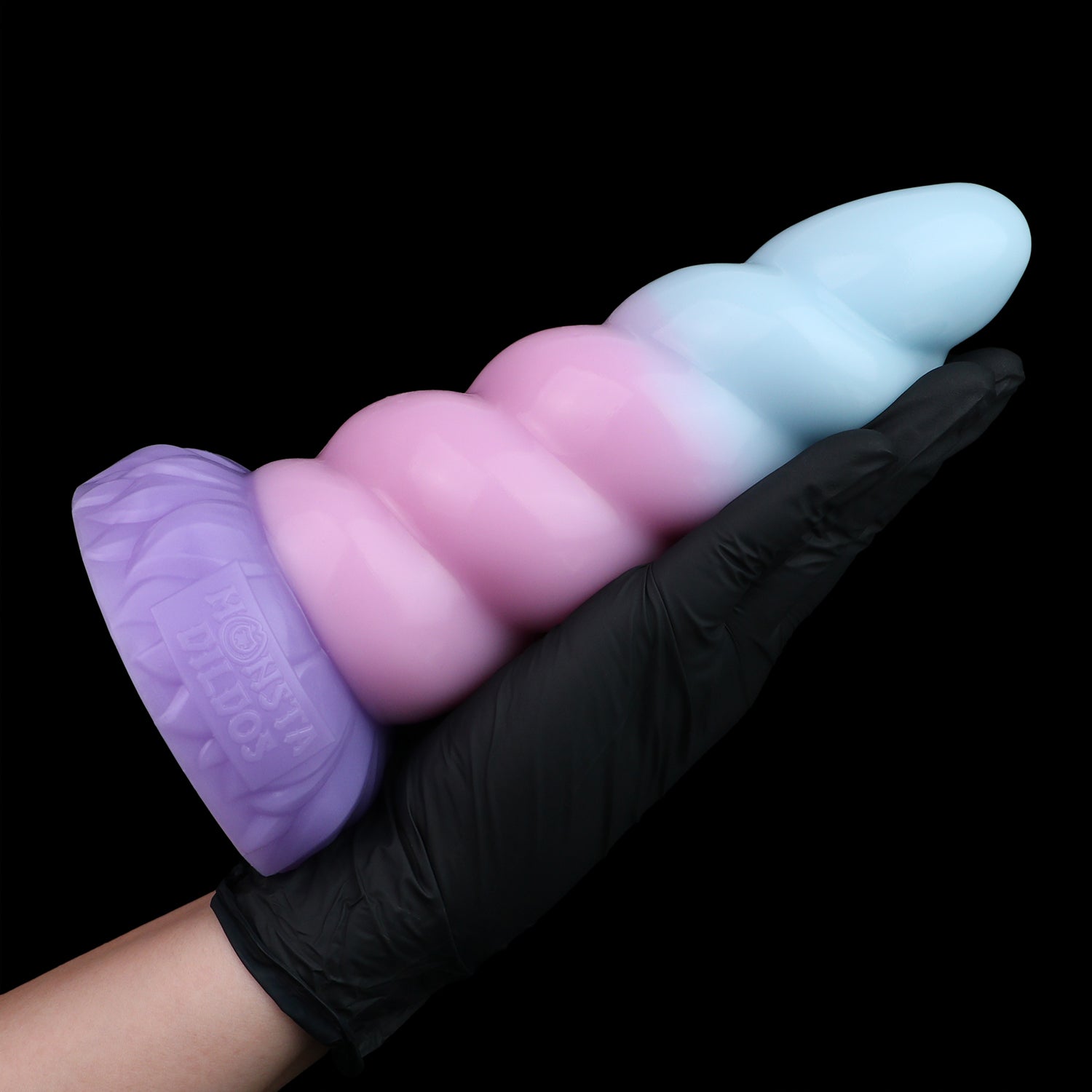 Alicorn the Unicorn dildo, Bubblegum colorway, held in hand for size reference