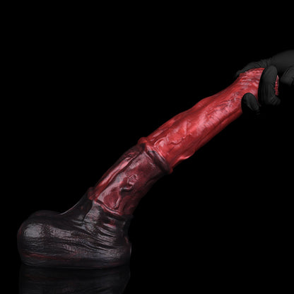 Atlas the Celestial Stallion dildo, Lava colorway, held in hand showing flexibility