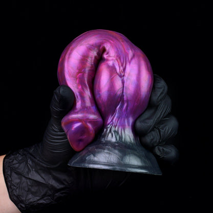 Darkhound the Canine Alpha dildo, Adrenaline colorway, gloved hand gripping the pronounced canine knot
