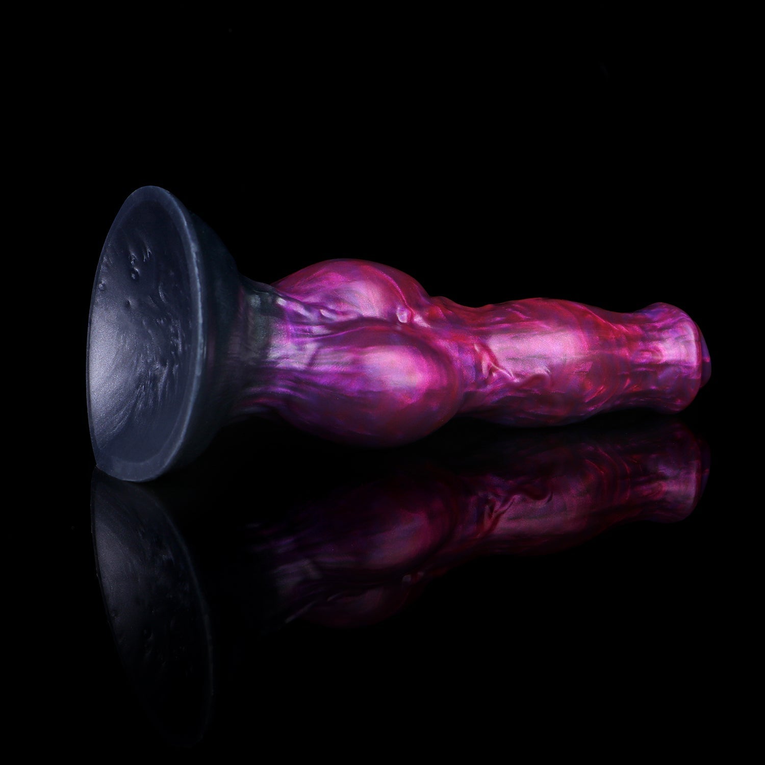 Darkhound the Canine Alpha dildo, Adrenaline colorway, lying on its side with the wide suction-cup base facing the camera