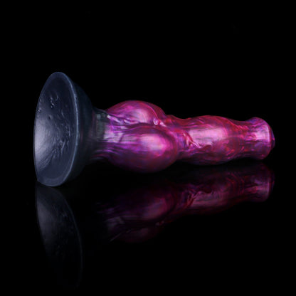 Darkhound the Canine Alpha dildo, Adrenaline colorway, lying on its side with the wide suction-cup base facing the camera