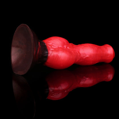 Darkhound the Canine Alpha dildo, Furnace colorway, angled to show the wide suction-cup base