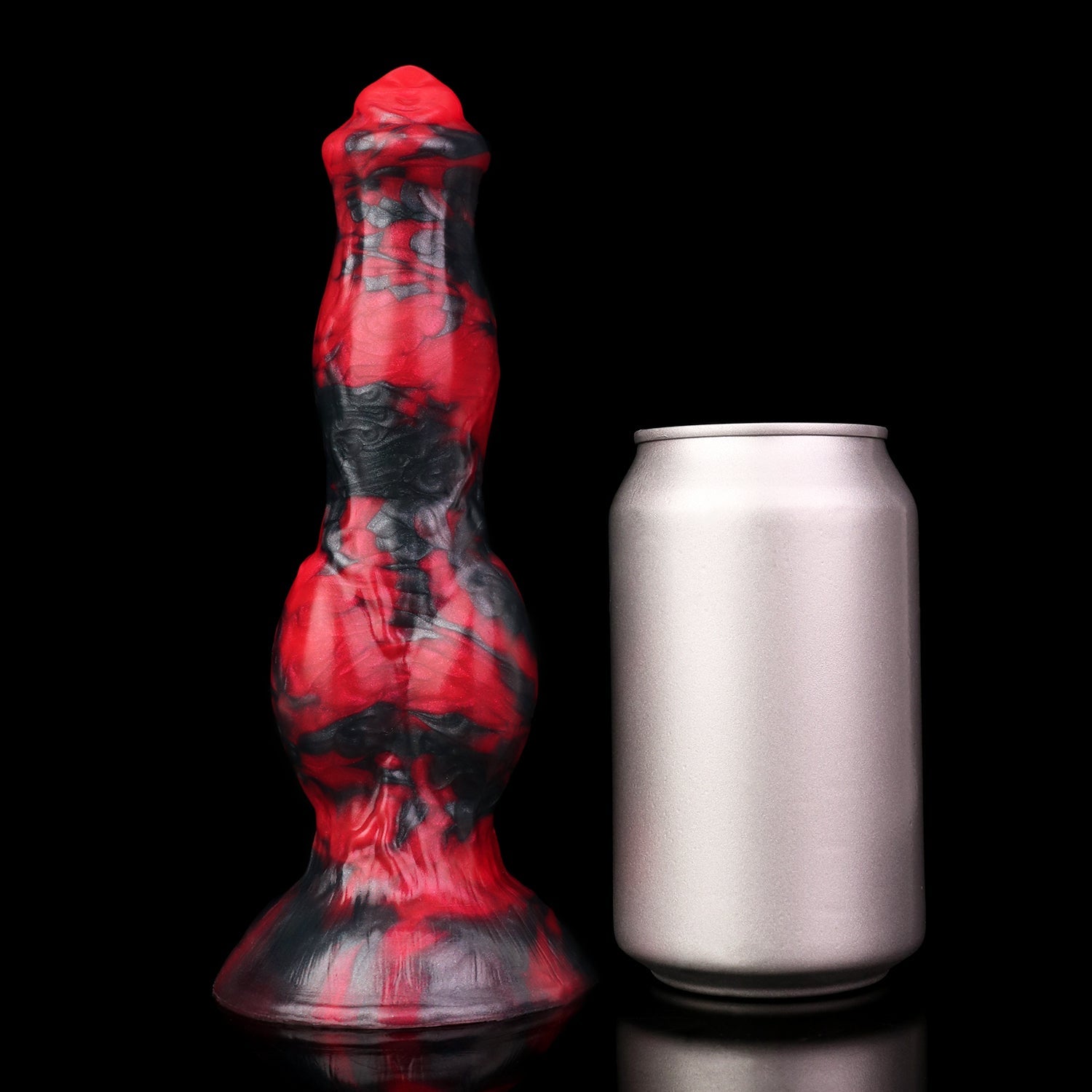 Darkhound the Canine Alpha dildo, Havoc colorway, standing upright beside a soda can for size comparison