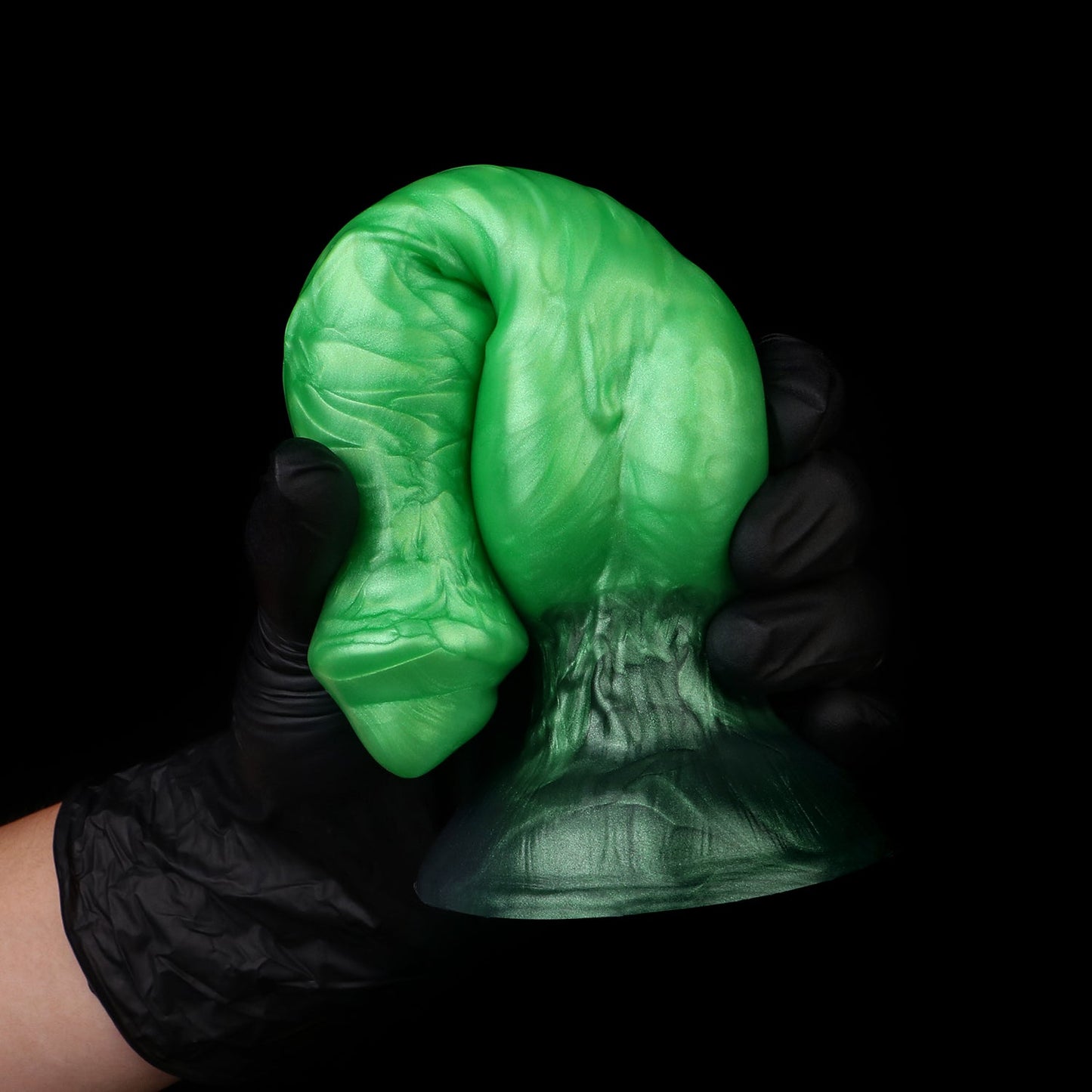 Darkhound the Canine Alpha dildo, Rampage colorway, gloved hand gripping the pronounced canine knot