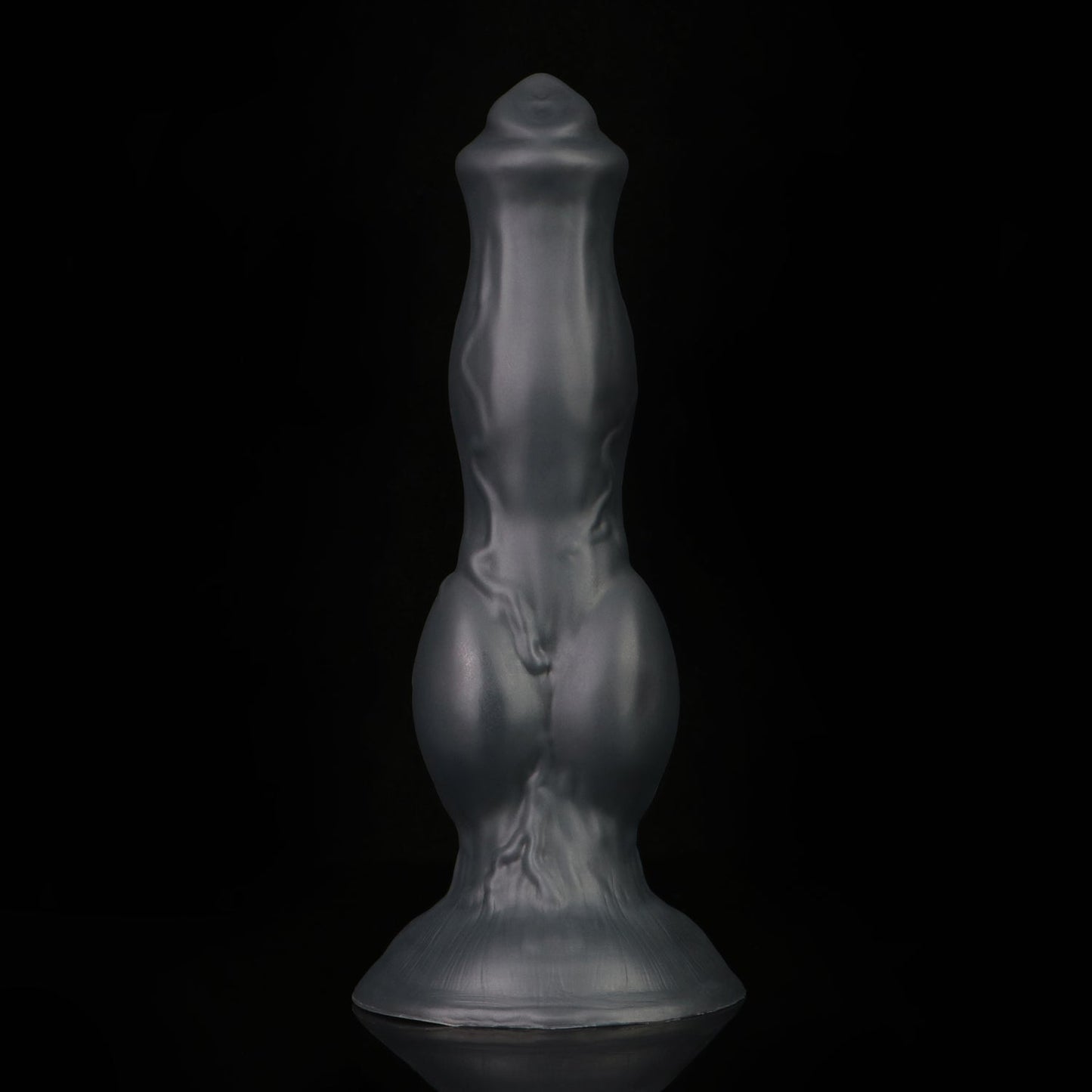 Darkhound the Canine Alpha dildo, Shadow colorway, standing upright in low-key lighting showing the deep low-sheen charcoal-black finish