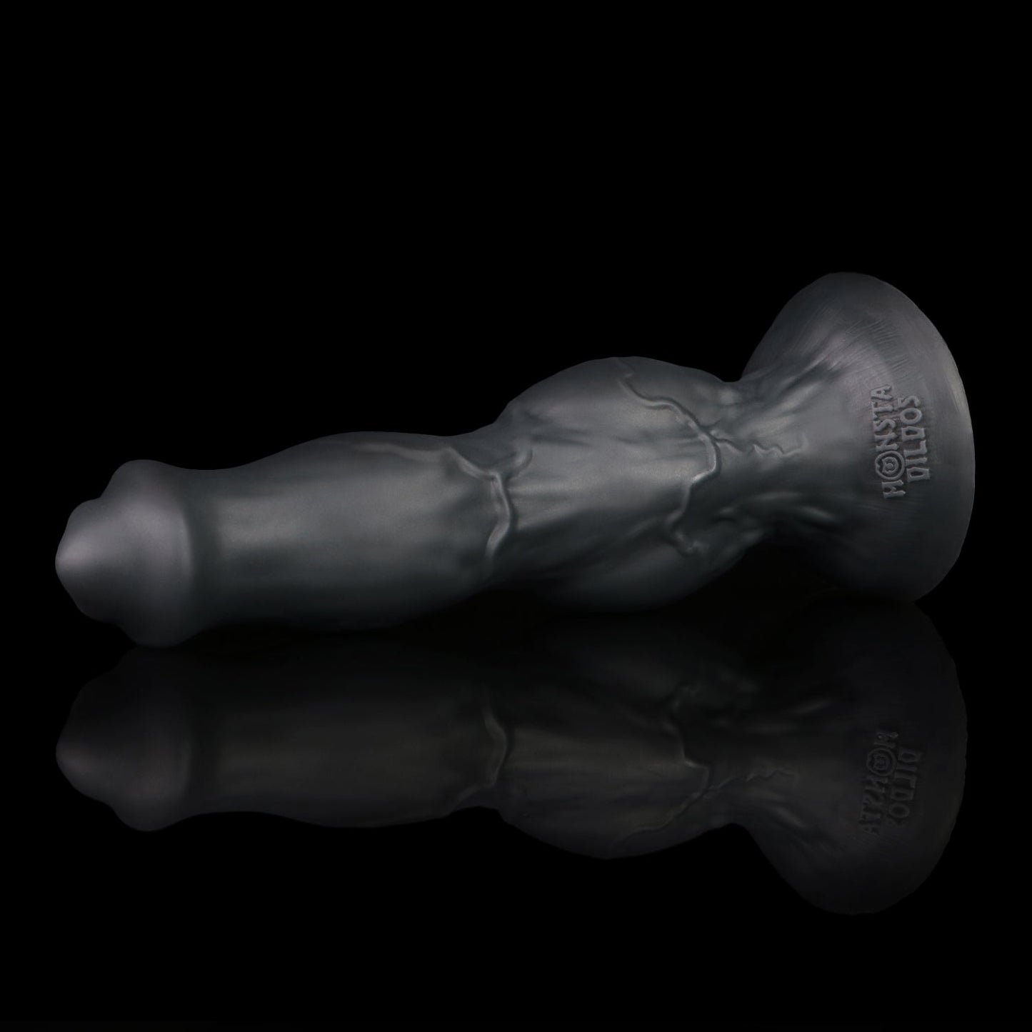 Darkhound the Canine Alpha dildo, Shadow colorway, resting at an angle on its wide suction-cup base