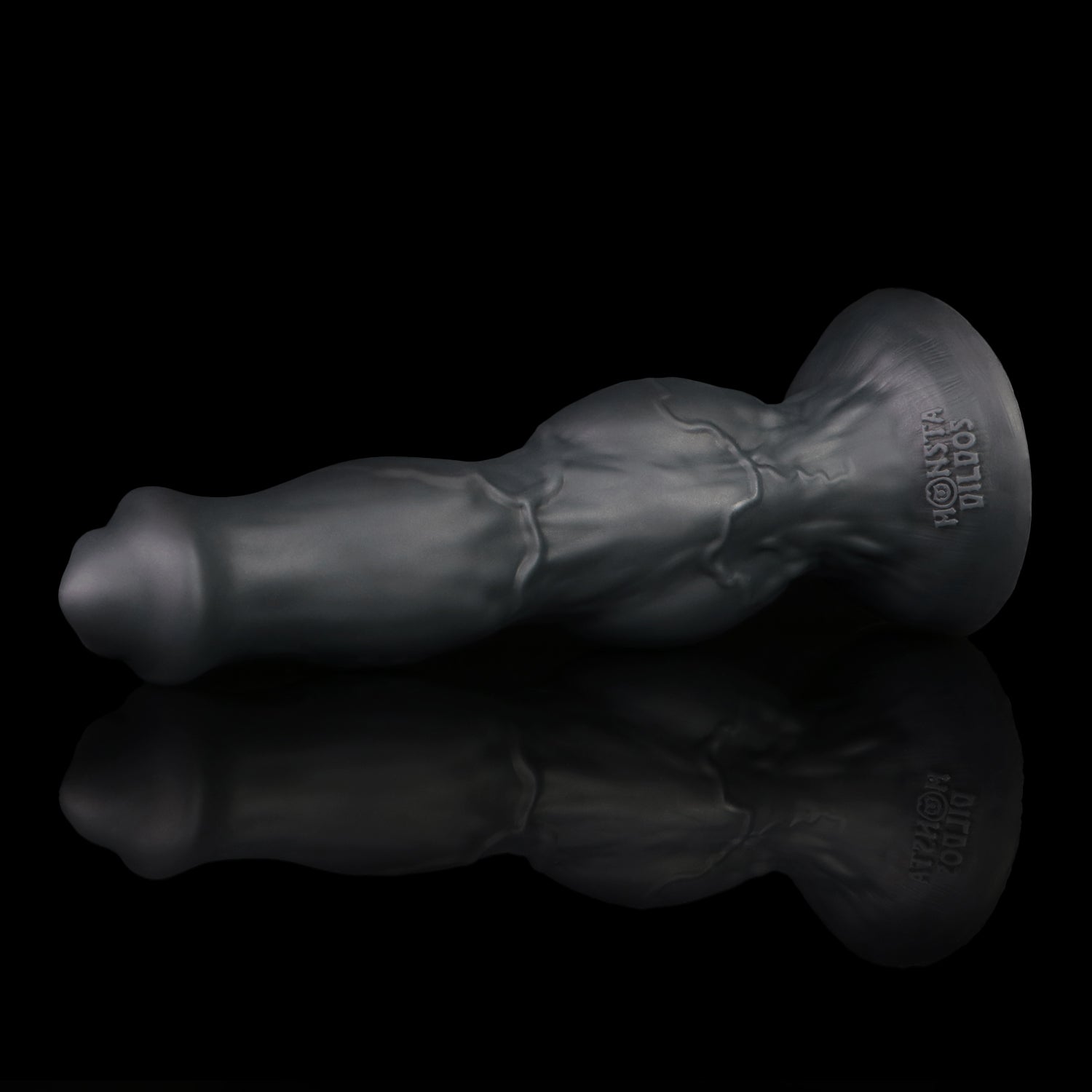 Darkhound the Canine Alpha dildo, Shadow colorway, resting at an angle on its wide suction-cup base