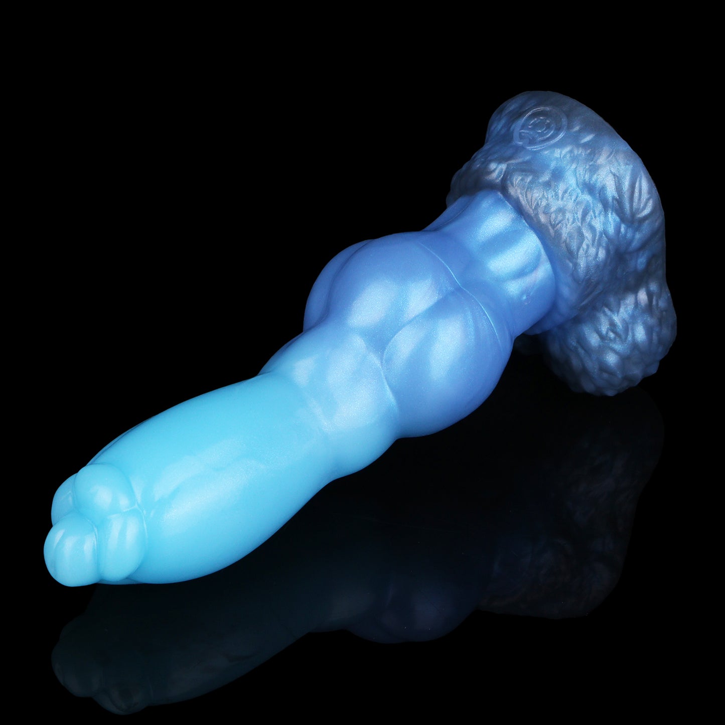 Evren the Moonfang dildo, Arctic colorway, lying on its side showing the fur-textured suction-cup base