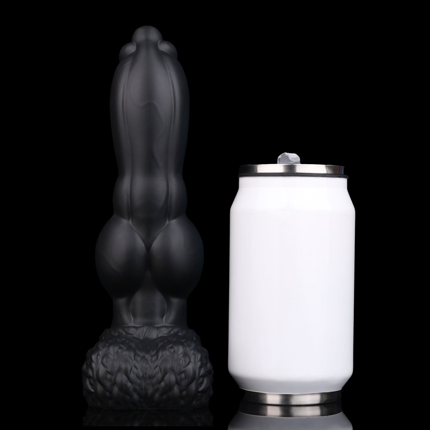 Evren the Moonfang dildo, Shadow colorway, standing upright beside a soda can for size comparison