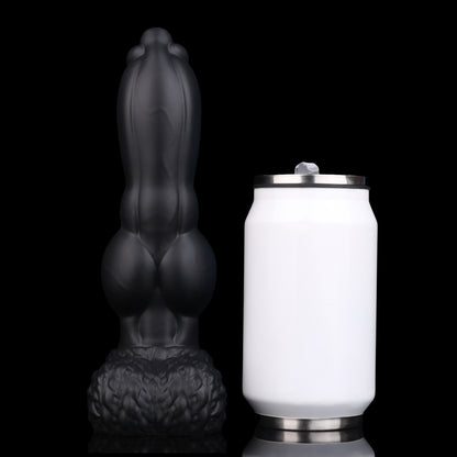 Evren the Moonfang dildo, Shadow colorway, standing upright beside a soda can for size comparison