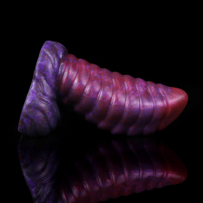 Kael the Dragonkin dildo, Adrenaline colorway, lying on its side in full profile showing the ribbed shaft and scale-textured base