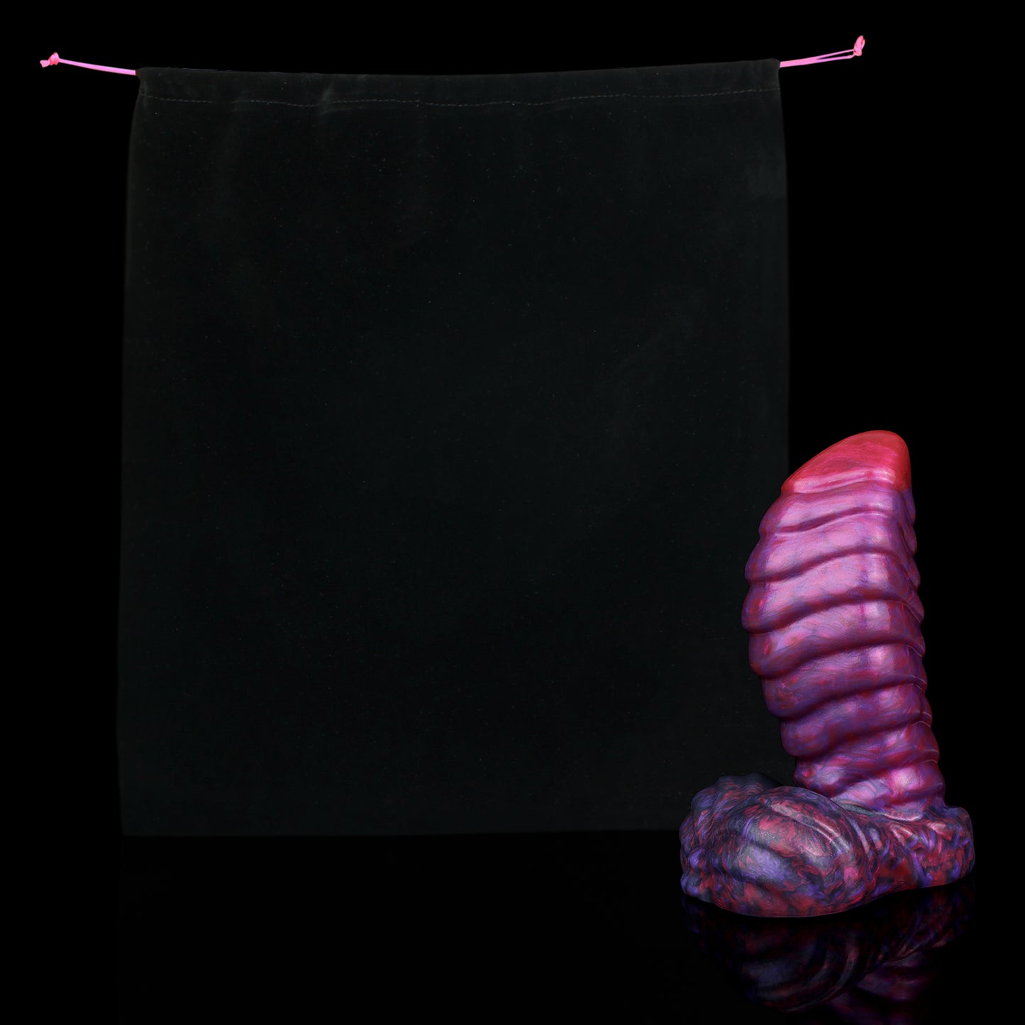 Kael the Dragonkin dildo, Adrenaline colorway, shown alongside the included black Lunara's Realm storage pouch
