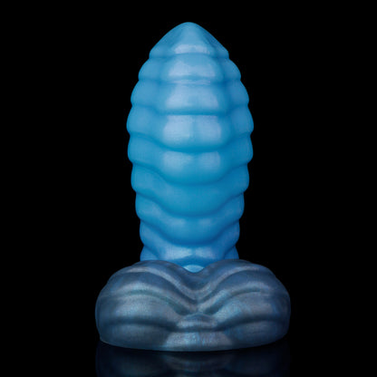 Kael the Dragonkin dildo, Arctic colorway, front view showing the luminous icy blue shaft deepening to slate-blue at the base