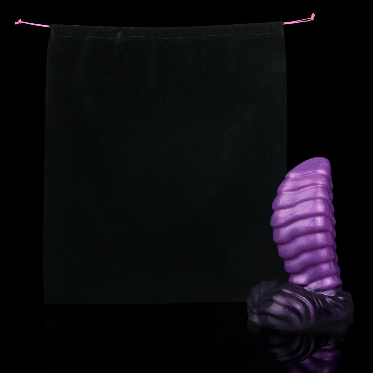 Kael the Dragonkin dildo, Grape colorway, shown alongside the included black Lunara's Realm storage pouch