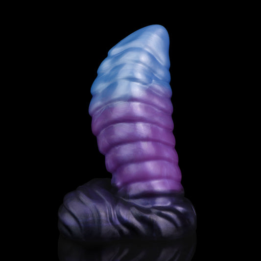 Kael the Dragonkin dildo, Spectre colorway, standing upright on its scale-textured base showing the curved, ribbed segmented shaft