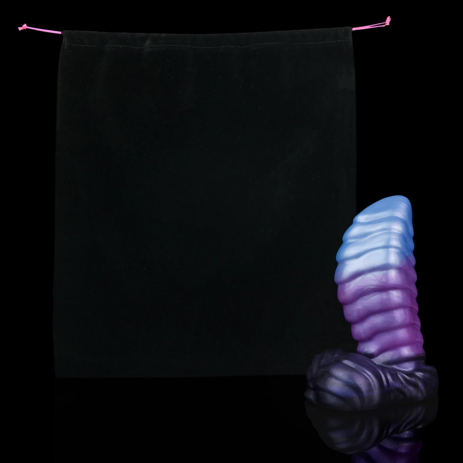 Kael the Dragonkin dildo, Spectre colorway, shown alongside the included black Lunara's Realm storage pouch