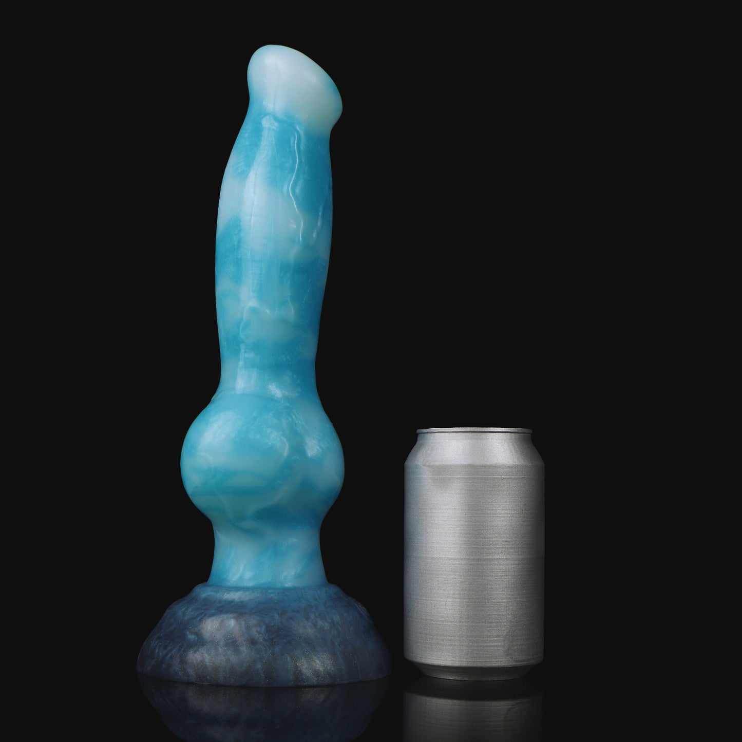 Koda the Guardian dildo, Blizzard colorway, standing upright beside a soda can for size comparison