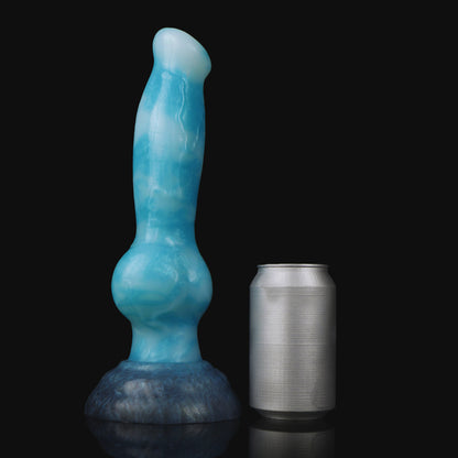 Koda the Guardian dildo, Blizzard colorway, standing upright beside a soda can for size comparison