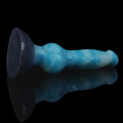 Koda the Guardian dildo, Blizzard colorway, angled to show the sturdy rounded suction base