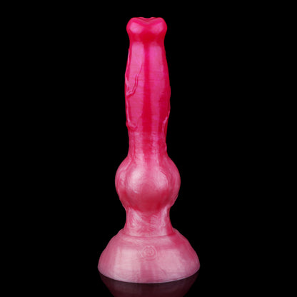 Koda the Guardian dildo, Blush colorway, standing upright on its rounded base showing the tapered head, veined shaft and knot