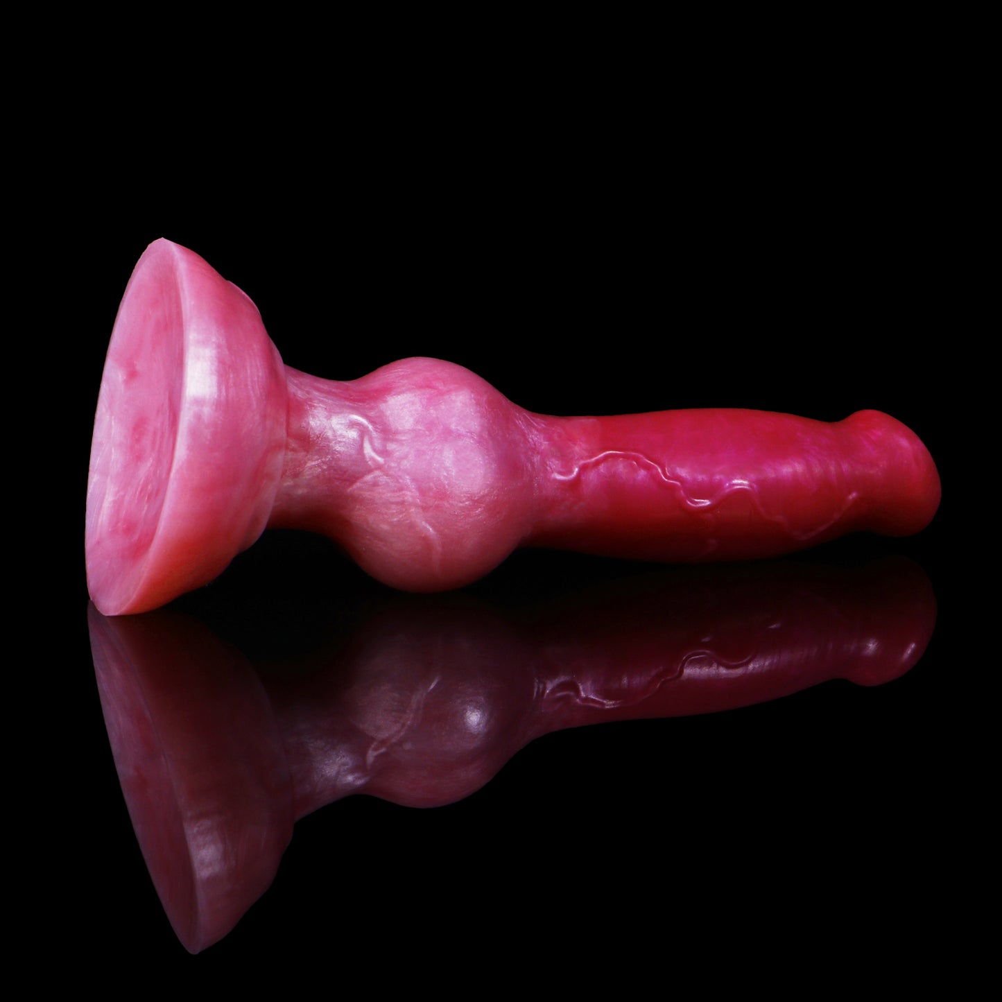 Koda the Guardian dildo, Blush colorway, angled to show the sturdy rounded suction base