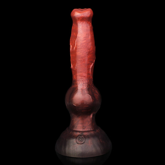 Koda the Guardian dildo, Lava colorway, standing upright on its rounded base showing the tapered head, veined shaft and knot