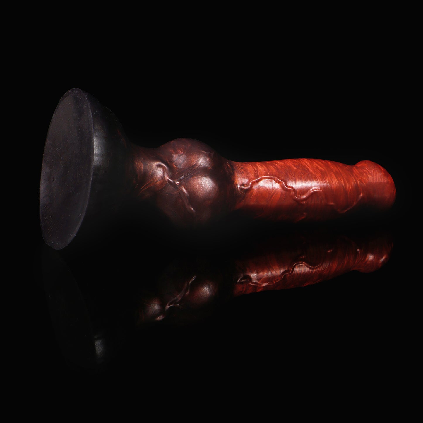 Koda the Guardian dildo, Lava colorway, angled to show the sturdy rounded suction base