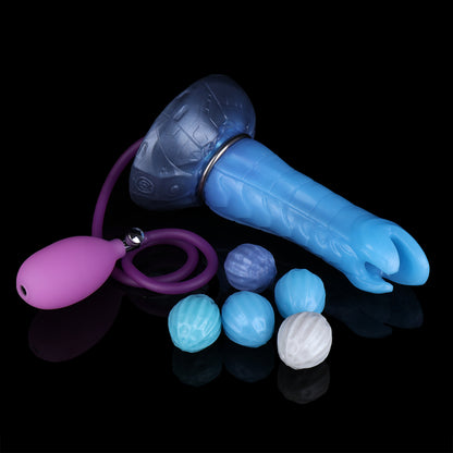 Kryptid the Breacher dildo, Arctic colorway, lying on its side alongside the pneumatic pump and interchangeable eggs
