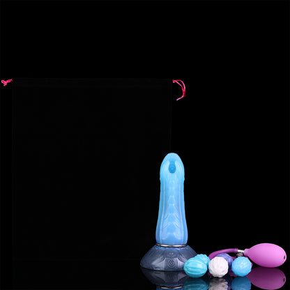 Kryptid the Breacher dildo, Arctic colorway, shown with the included storage pouch, pump and eggs