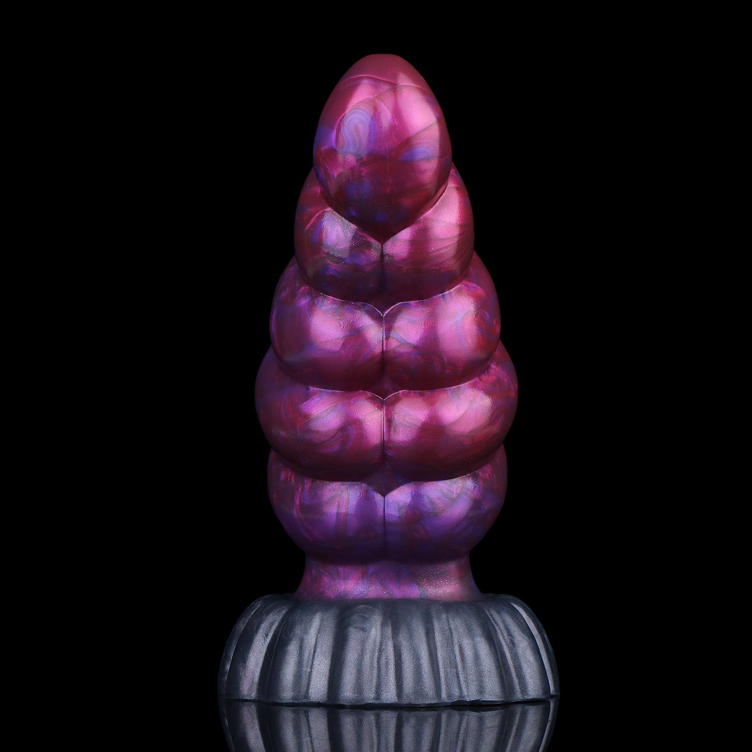 Larval the Alien Spawn dildo, Adrenaline colorway, standing upright showing the curved, segmented shaft
