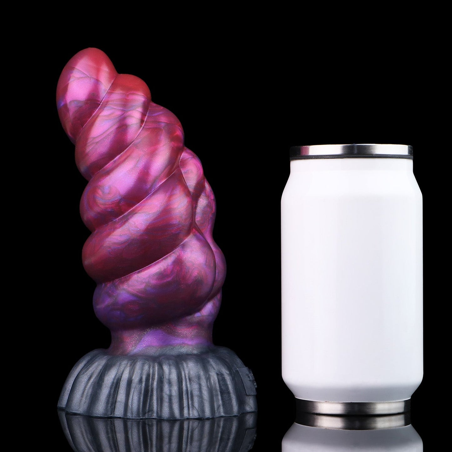 Larval the Alien Spawn dildo, Adrenaline colorway, standing upright beside a soda can for size comparison