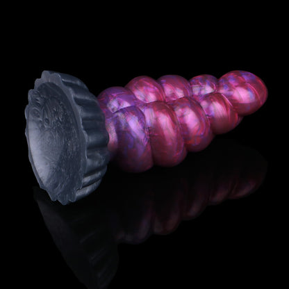 Larval the Alien Spawn dildo, Adrenaline colorway, tilted to show the broad round suction cup base