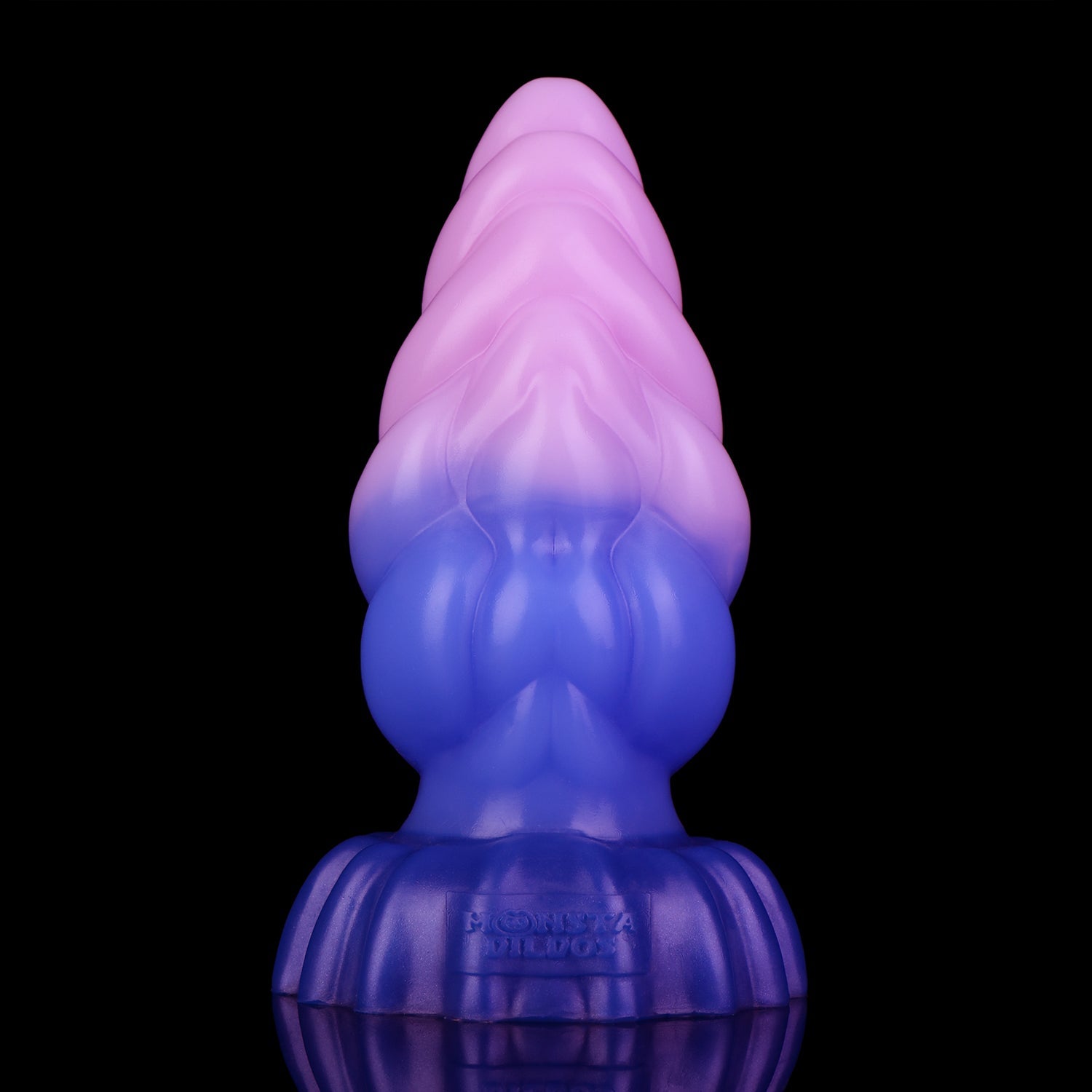 Larval the Alien Spawn dildo, Flux colorway, standing upright front-on showing the tapered pink tip and ribbed indigo base