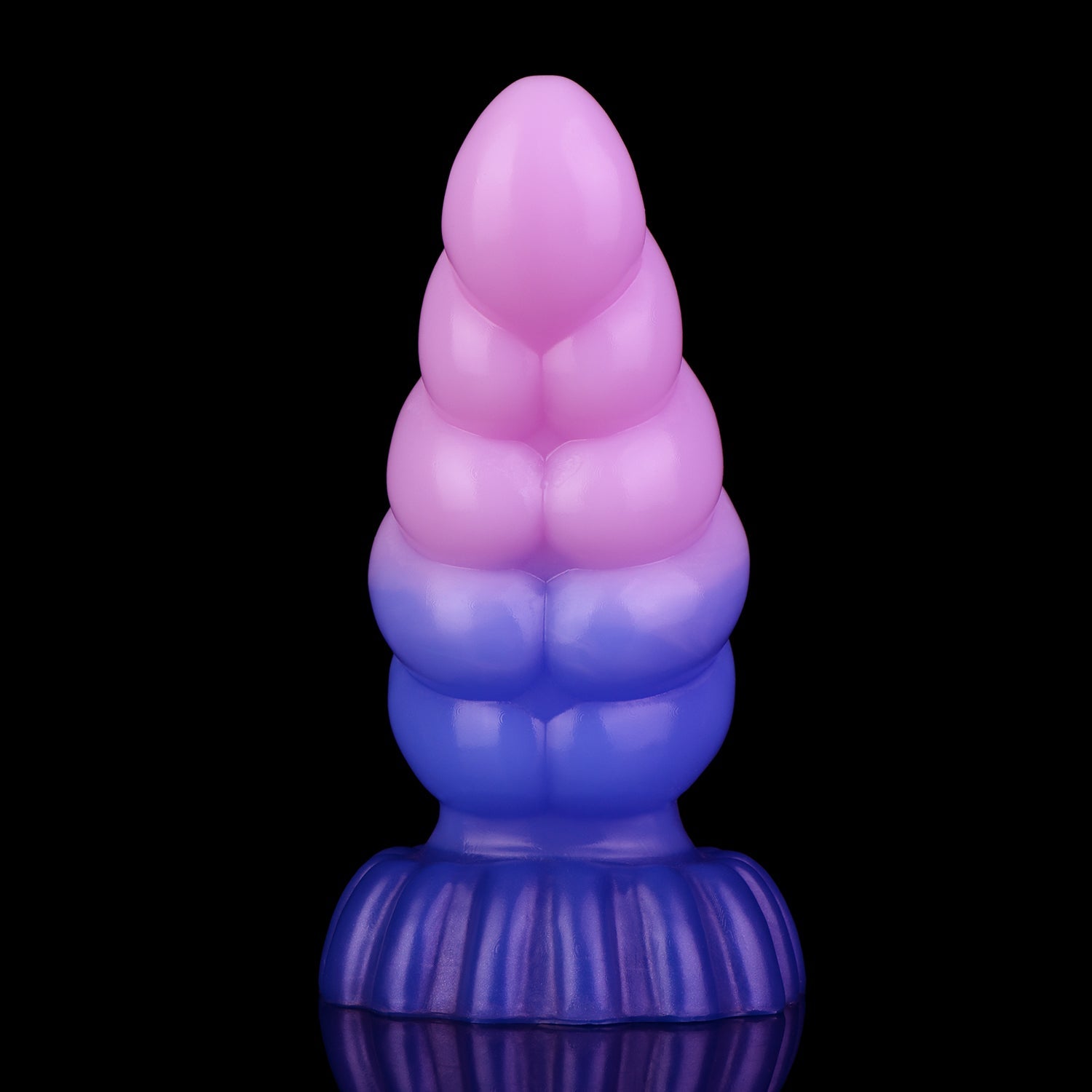 Larval the Alien Spawn dildo, Flux colorway, standing upright showing the ribbed segments along the curved shaft