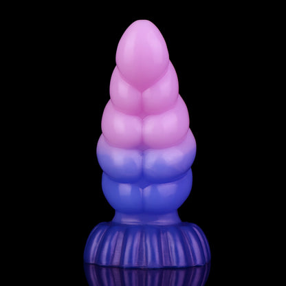 Larval the Alien Spawn dildo, Flux colorway, standing upright showing the ribbed segments along the curved shaft