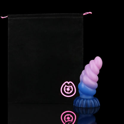 Larval the Alien Spawn dildo, Flux colorway, shown alongside the included black Lunara's Realm storage pouch