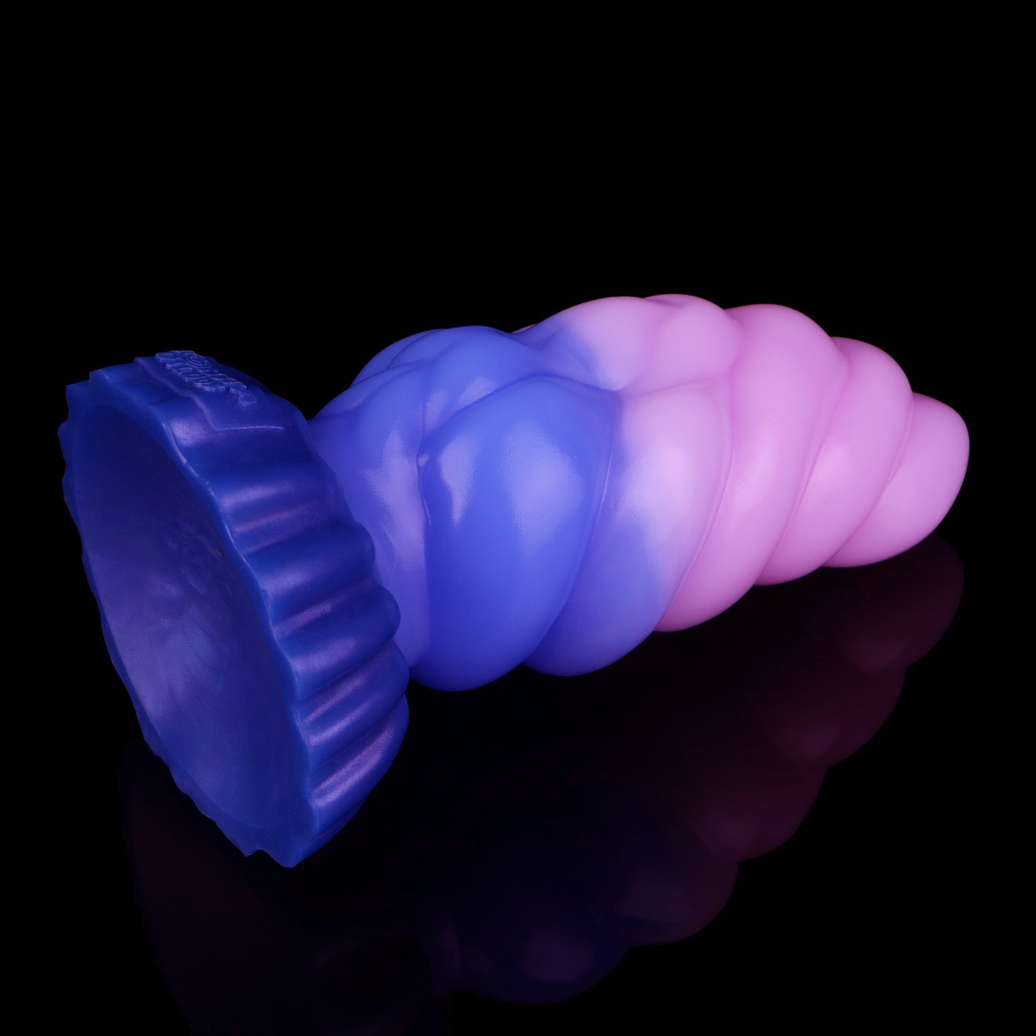 Larval the Alien Spawn dildo, Flux colorway, tilted to show the broad round suction cup base