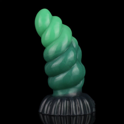 Larval the Alien Spawn dildo, Ogre colorway, standing upright with the curve turned toward the camera