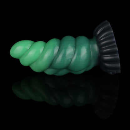 Larval the Alien Spawn dildo, Ogre colorway, lying on its side in full profile with the suction base to the right