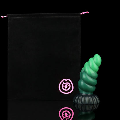 Larval the Alien Spawn dildo, Ogre colorway, shown alongside the included black Lunara's Realm storage pouch