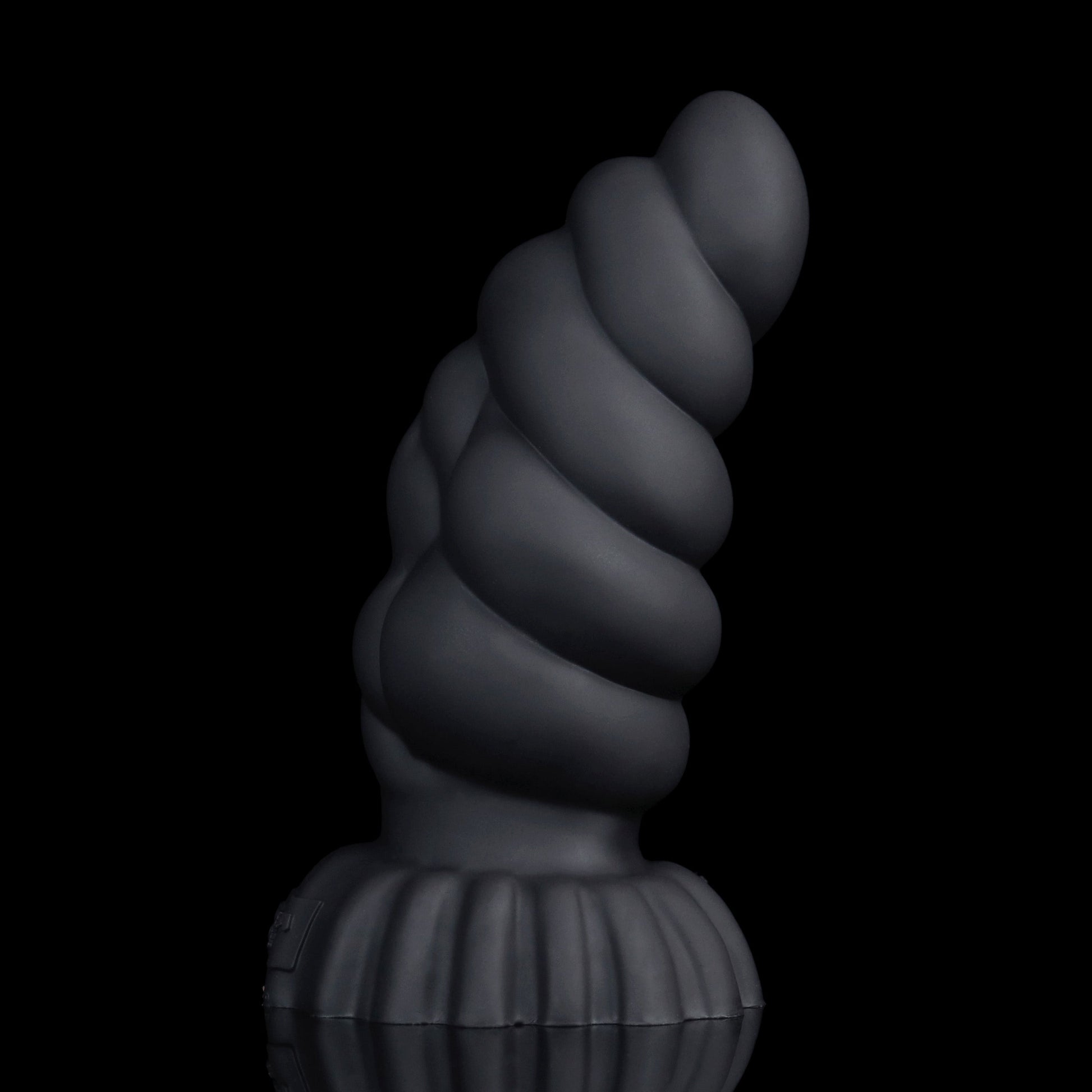 Larval the Alien Spawn dildo, Shadow colorway, standing upright on its ribbed round base showing the curved, segmented shaft