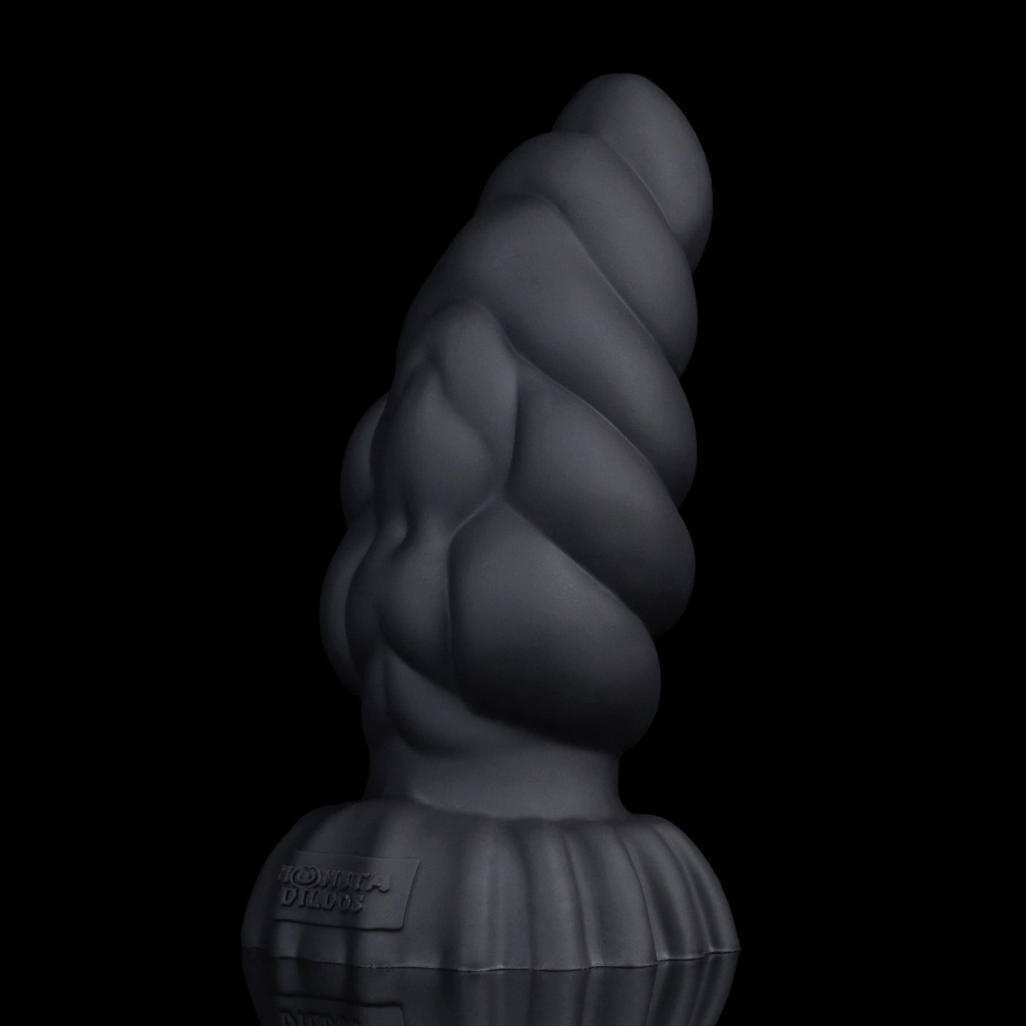 Larval the Alien Spawn dildo, Shadow colorway, standing upright showing the deep matte black finish along the curved shaft