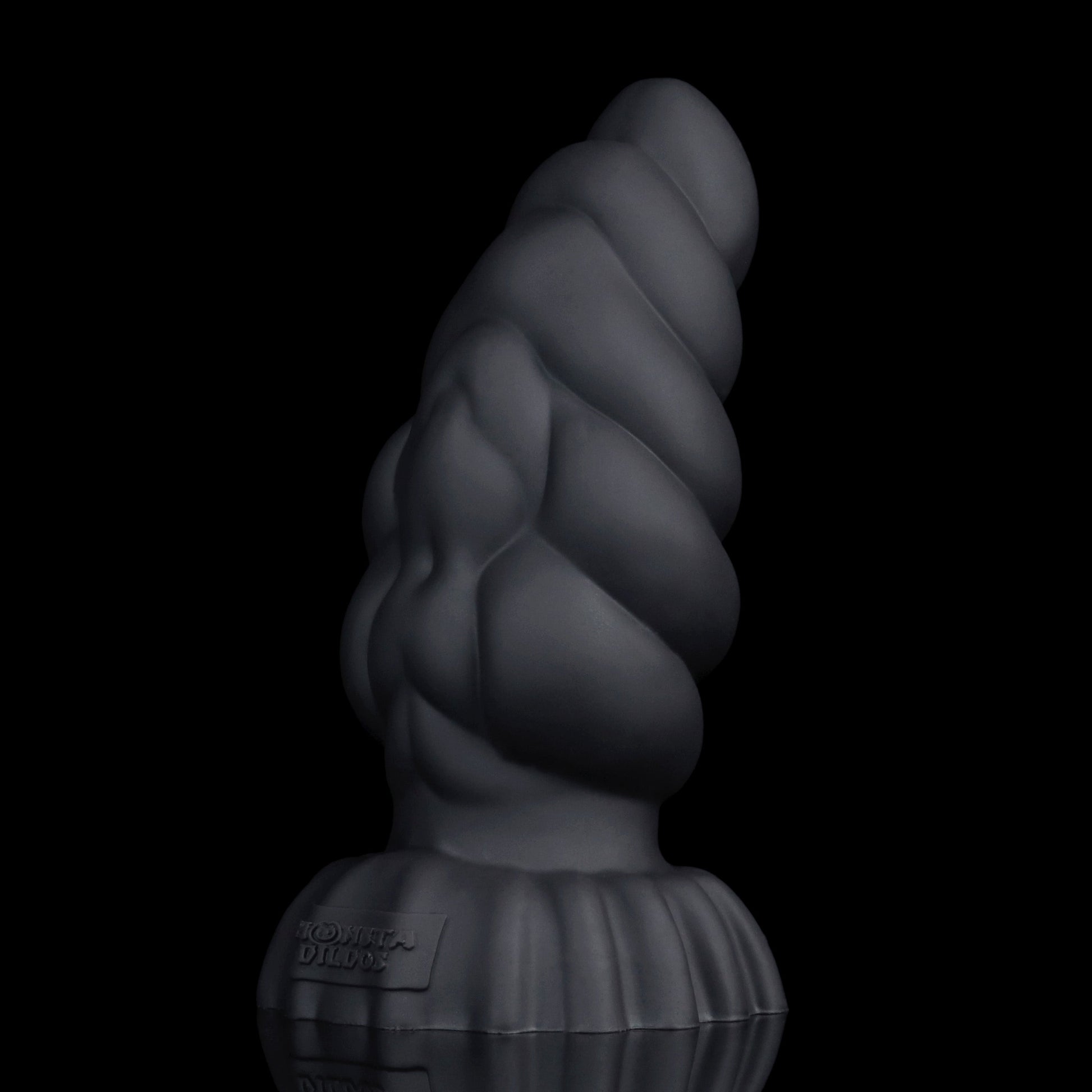 Larval the Alien Spawn dildo, Shadow colorway, standing upright showing the deep matte black finish along the curved shaft