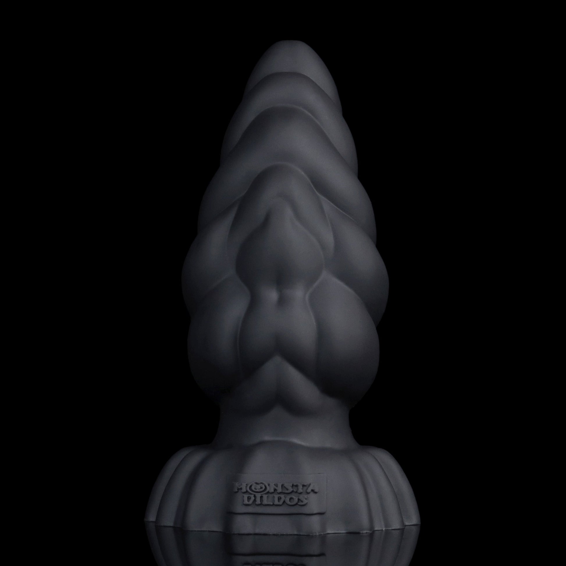Larval the Alien Spawn dildo, Shadow colorway, standing upright at an angle showing the ribbed segments and tapered tip