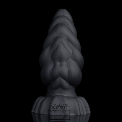 Larval the Alien Spawn dildo, Shadow colorway, standing upright at an angle showing the ribbed segments and tapered tip
