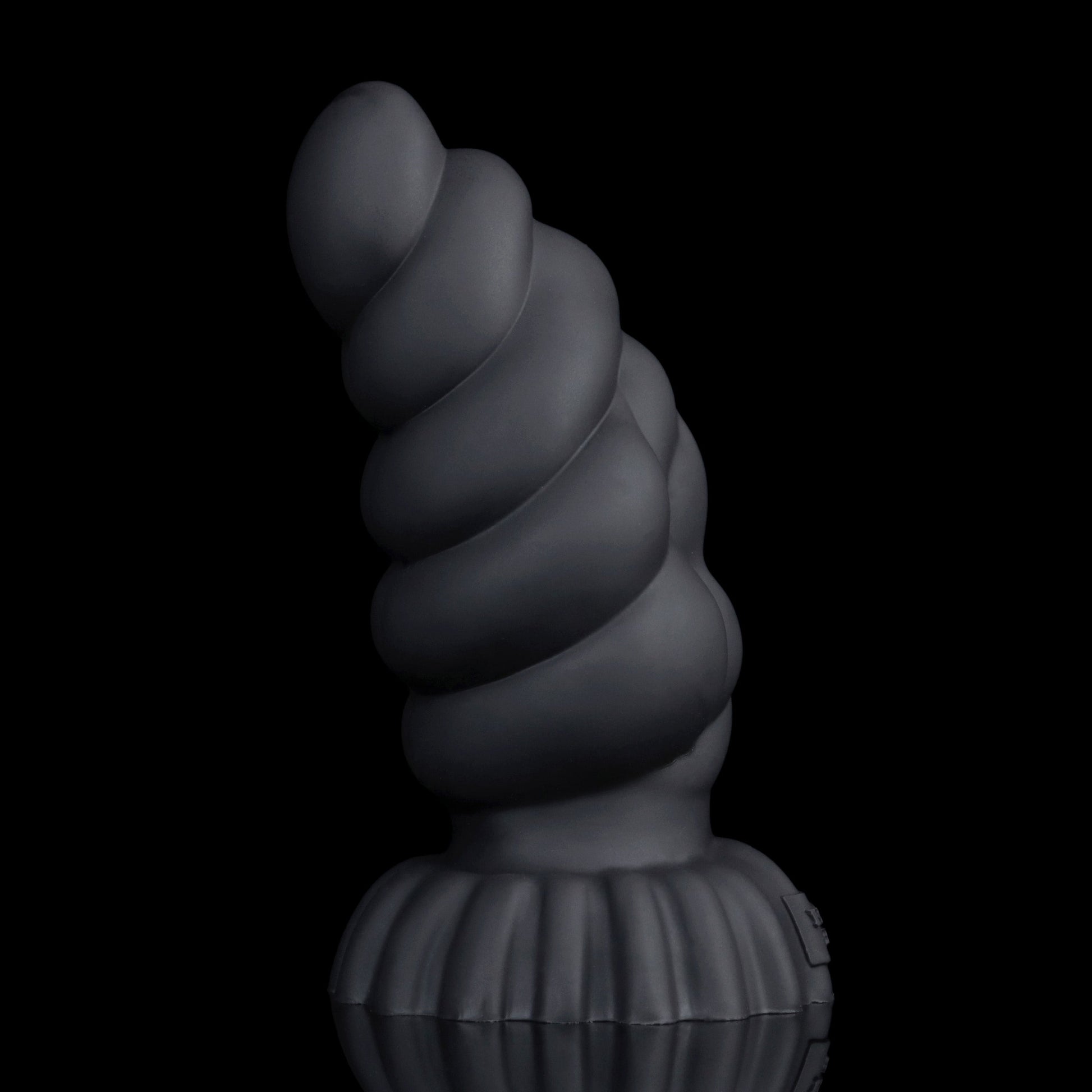Larval the Alien Spawn dildo, Shadow colorway, standing upright showing the arc of the curved shaft