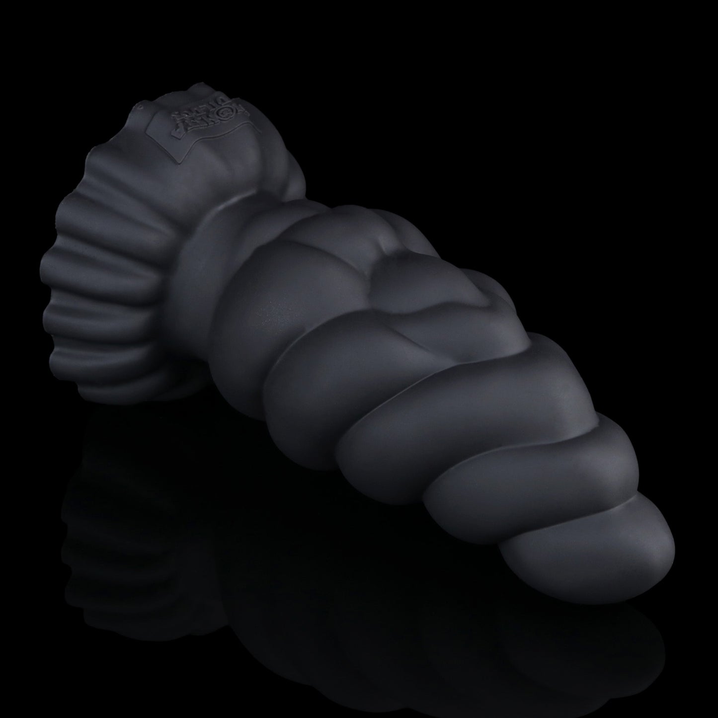 Larval the Alien Spawn dildo, Shadow colorway, lying on its side with the broad suction base to the left