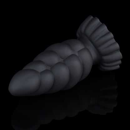 Larval the Alien Spawn dildo, Shadow colorway, lying on its side in full profile showing the ribbed shaft and suction base