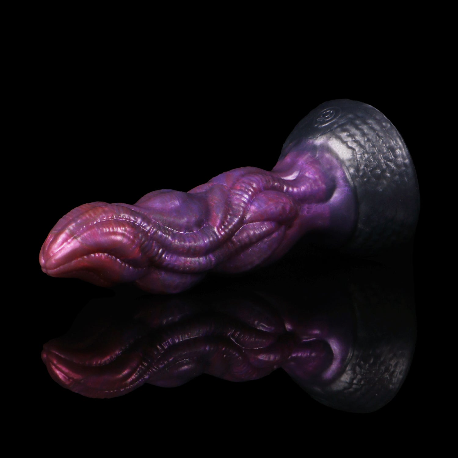 Lumen the Bloomborn dildo, Adrenaline colorway, lying on its side in full profile showing the tentacle-like shaft